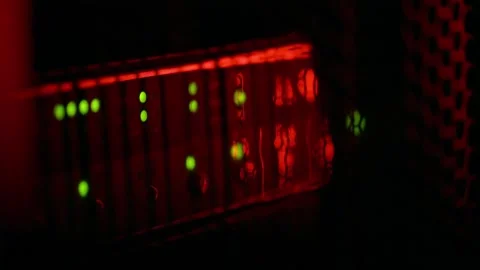 Server rack lights blinking with blue and red ambient lighting in dark data.. Stock Footage 339651183
