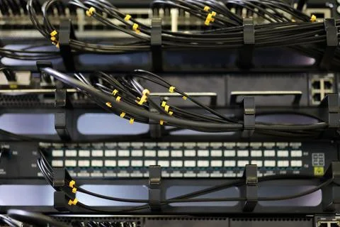 Server rack with metal horizontal cable managers Stock Photos