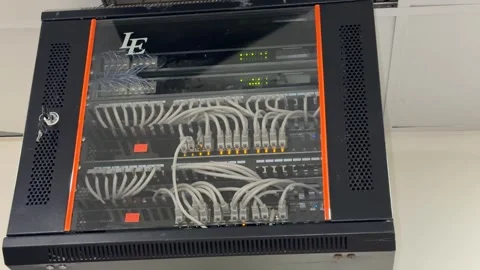 Server rack with network cables and blinking lights, showcasing technology .. Stock Footage 324707413