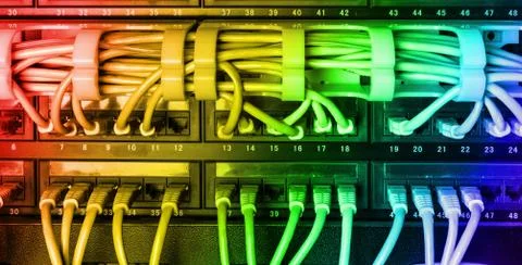 Server rack with rainbow internet patch cord cables Stock Photos