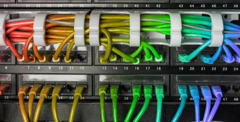 Server rack with rainbow internet patch cord cables Stock Photos