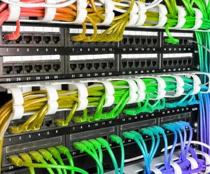 Server rack with rainbow internet patch cord cables Stock Photos