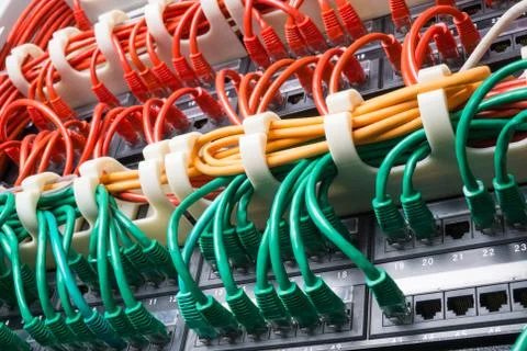 Server rack with red, yellow and green cables Stock Photos