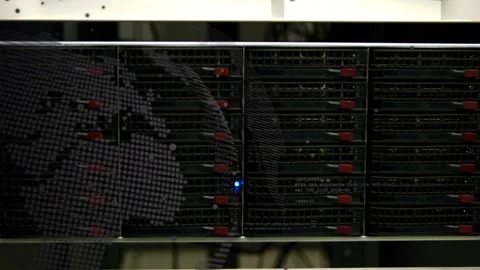 Server rack showing faint left reflection, tech leaning and checking drives for Stock Footage 332566512