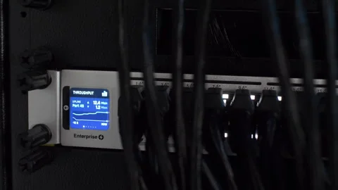 Server Rack With Small LED Screen Showing Throughput Megabits per second Video stock 254684219