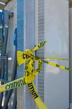 Server rack with yellow caution tape in data center Stock Photos