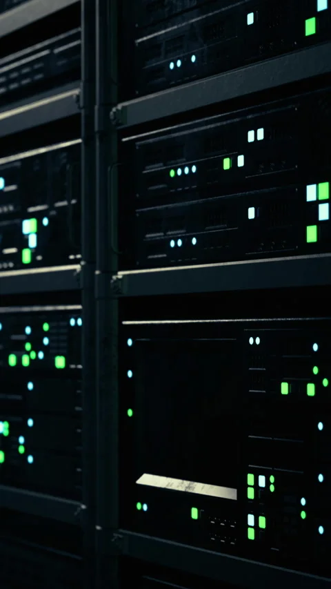 Server racks lit by green and blue lights in a dark data center Stock Footage 334725030