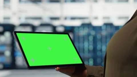 Server room admin uses isolated screen tablet to increase workload capacity Stock Photos