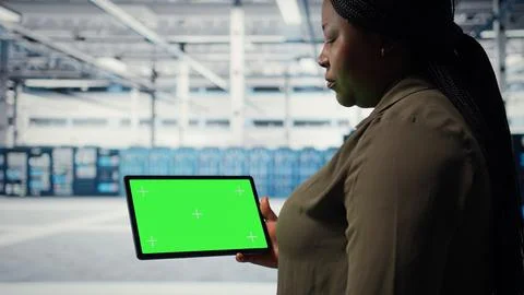 Server room admin uses isolated screen tablet to increase workload capacity 写真素材