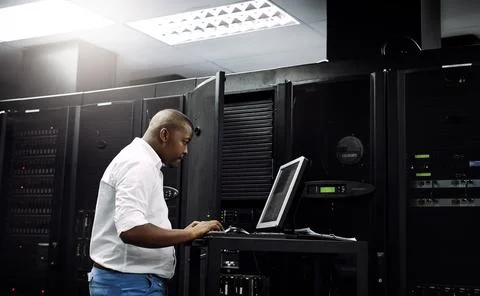 Server room, black man or coding on computer for programming or digital error in Stock Photos