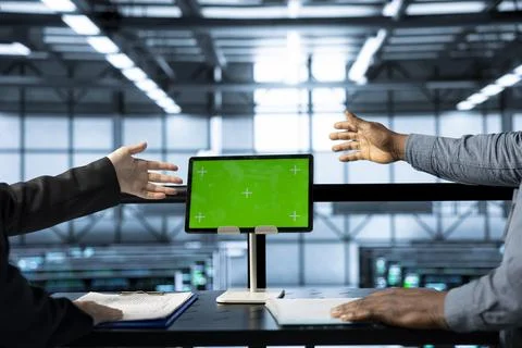 Server room colleagues using mockup device to configure cluster nodes Stock Photos
