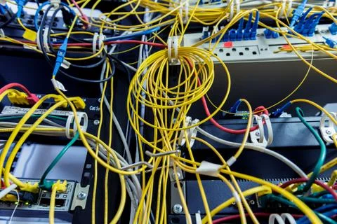 Server room with computers for internet. Network cables connected to switches. Stock Photos