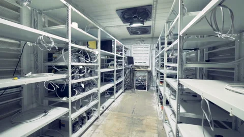 Server room for crypto currency mining. Row of bitcoin miners set up on the Stock Footage 88047461