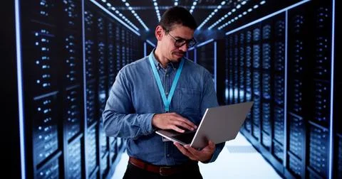 Server Room In Data Center. Cloud Computer Engineer Configuring AI Technology Stock Photos