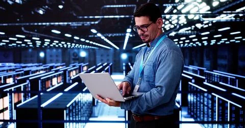 Server Room In Data Center. Cloud Computer Engineer Configuring AI Technology 写真素材