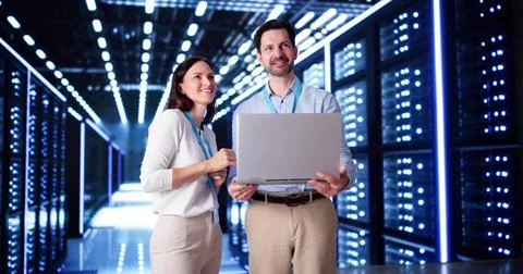 Server Room In Data Center. Cloud Computer Engineers Configuring AI Technolog Stock Photos