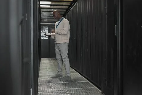 Server room, data center or IT black man with laptop for research, engineer Stock Photos