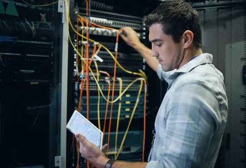 Server room, engineer and man working with a tablet for programming Stock-Fotos