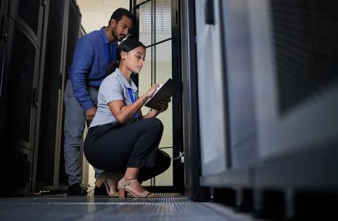 Server room, engineer and team with tablet for database connection cable Stock Photos