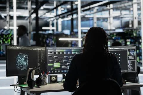 Server room engineer using AI and node trees to enhance operational efficiency Stock Photos