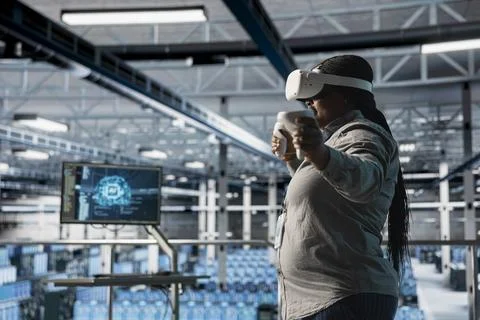 Server room engineer using VR gear, programming algorithms for AI data analysis Stock Photos