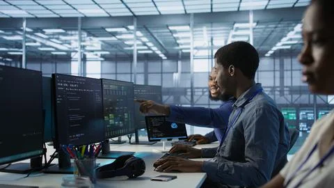 Server room engineers using artificial intelligence Stock Photos