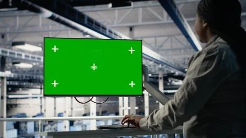 Server room female programmer using green screen computer 写真素材