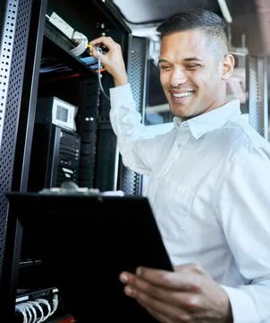 Server room, IT support and database with a man programmer working on a Stock Photos