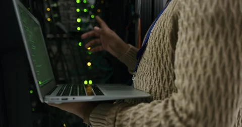 Server room, laptop and hands of technician coding or programming cyber security Stock Footage 243021688