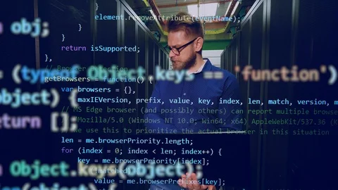 Server room with the male programmer and the code appearing along him Stock Footage 114739329
