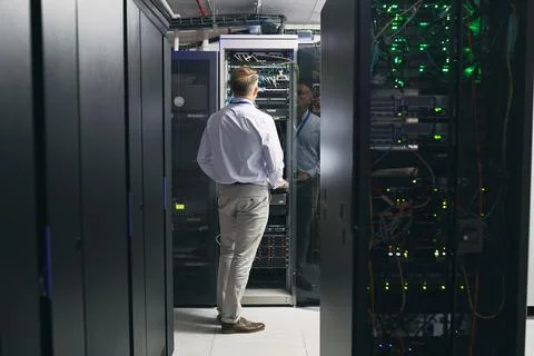 Server room, man and back with inspection for database system, maintenance or 写真素材
