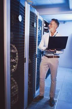 Server room, man and technician with laptop for cyber security, system 스톡 사진