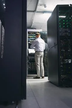 Server room, man and time with inspection for database system, maintenance .. Foto stock