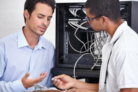 Server room, man or technician with clipboard for technology in cyber security Stock Photos