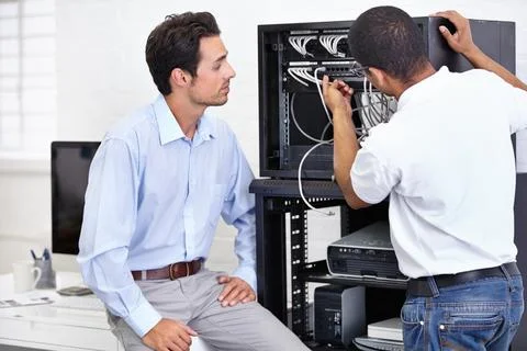 Server room, man or technician with working on hardware maintenance after glitch Stock Photos