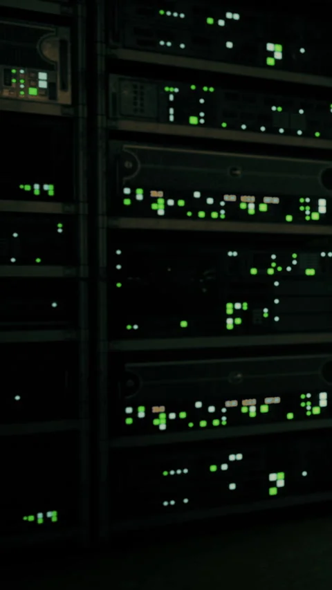 Server room with multiple machines displaying green lights in operation Stock Footage 336572204