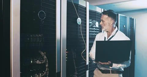 Server room, programmer and man with laptop, inspection and hardware problem Stock Photos