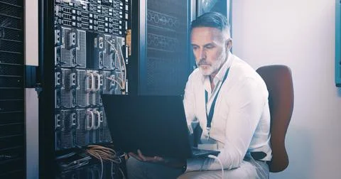 Server room, programmer and man with laptop, online reading and hardware problem Stock Photos