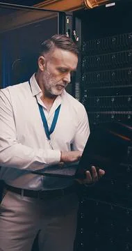 Server room, programmer and man with laptop, cyber security and hardware problem 写真素材