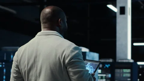 Server room software developer troubleshooting errors using software Stock Footage 311833562