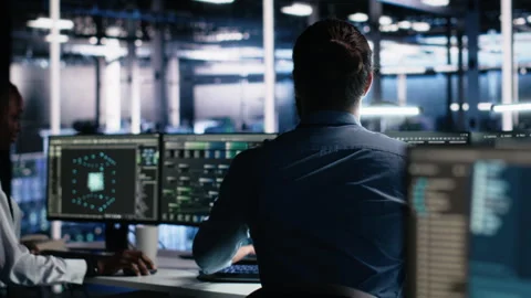 Server room software developer using AI to review infrastructure diagnostics Stock Footage 313566199