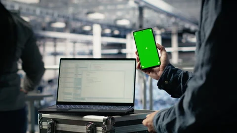 Server room software developer using mockup phone Stock Footage 314803511