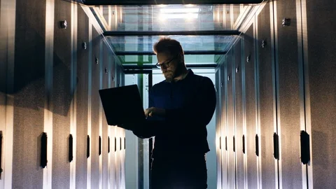 Server room with a support engineer operating a computer Video stock 115659719