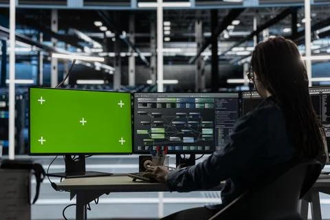 Server room technician using artificial intelligence tech on green screen PC Foto stock