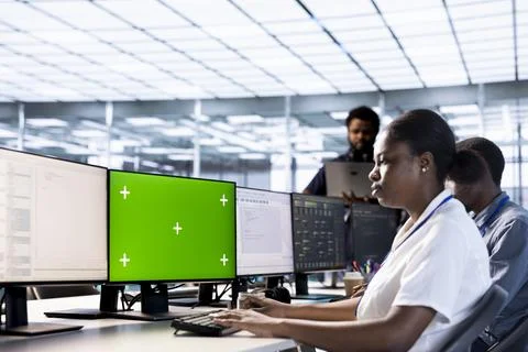 Server room technician using green screen computer Foto stock