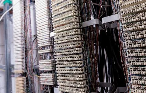 Server room. Telephone cables connected to switches. Stock Photos