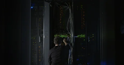 Server Room Worker Plugging in Cable Wide Stock Footage 101501803