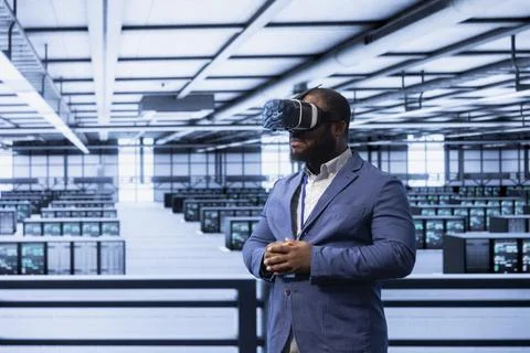 Server room worker resolving technical issues using virtual reality tech Stock Photos