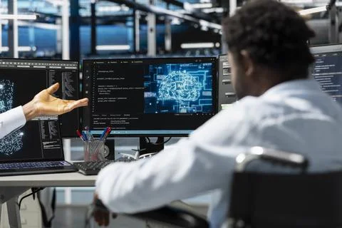 Server room worker using AI to perform demanding computing tasks 写真素材