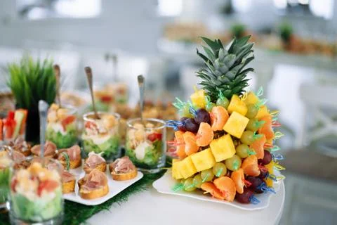 Server table canapes in the shape of pineapple 写真素材